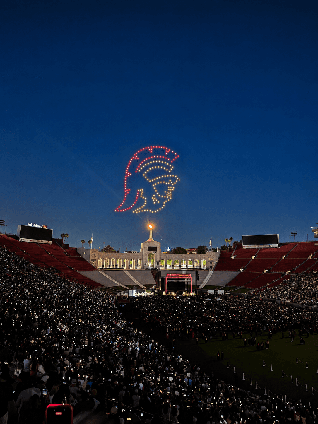 Light-show drones forming Tommy the Trojan above the USC graduation ceremony